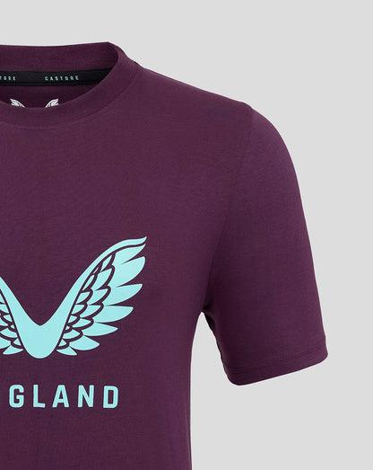 Close-up of the purple England cricket tee showing a large light blue wing crest on the chest.