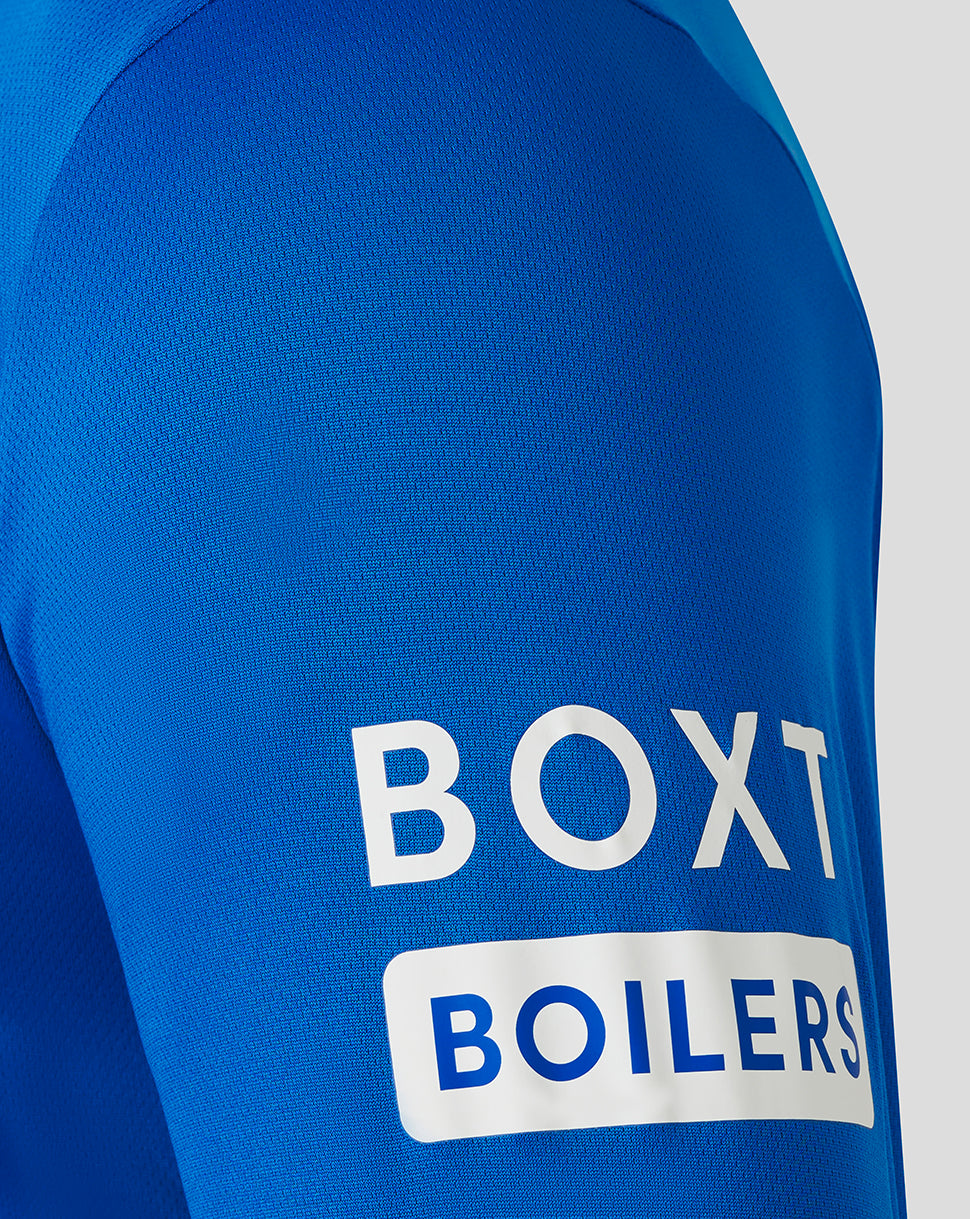 Close-up of blue jersey sleeve with BOXT BOILERS sponsor graphic.