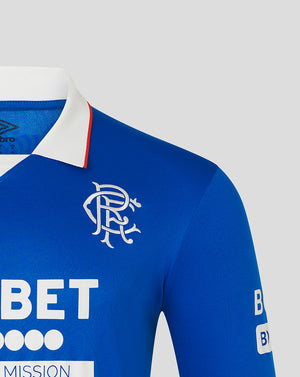 Close up of blue Rangers home long sleeve shirt showing white collar and club crest on the chest.
