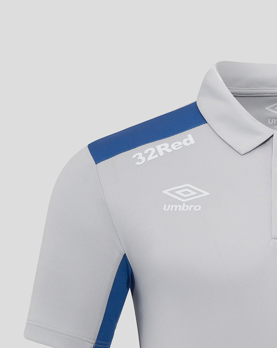 Close-up of Rangers polo chest featuring 32Red on the shoulder and the Umbro logo.