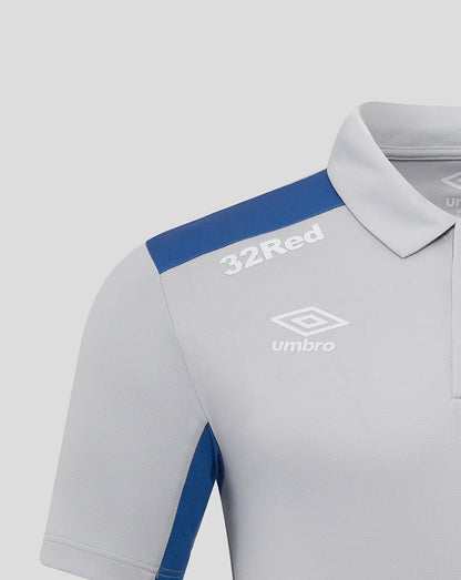 Close-up of Rangers polo chest featuring 32Red on the shoulder and the Umbro logo.