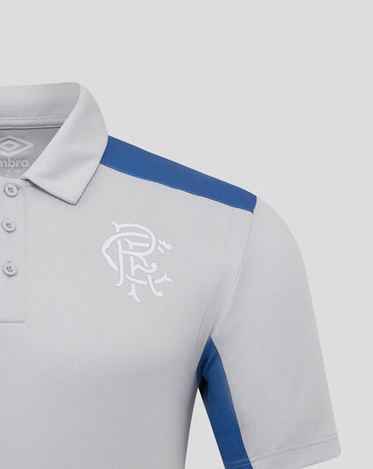 Close-up of Rangers polo collar and shoulder with blue stripe and white club crest on chest.