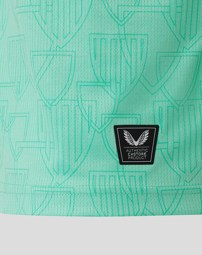 Close-up of back hem on turquoise Athletic Club Third Shirt showing authentic Castore product patch