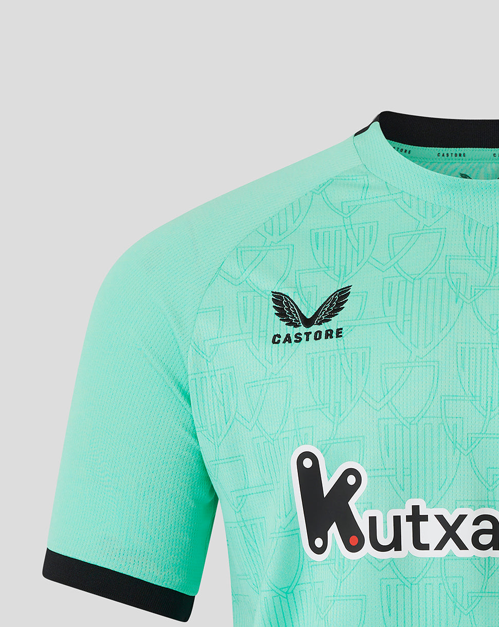 Close-up of turquoise Athletic Club Third Shirt showing Castore logo and club crest on the chest with bold sponsor graphic across the front