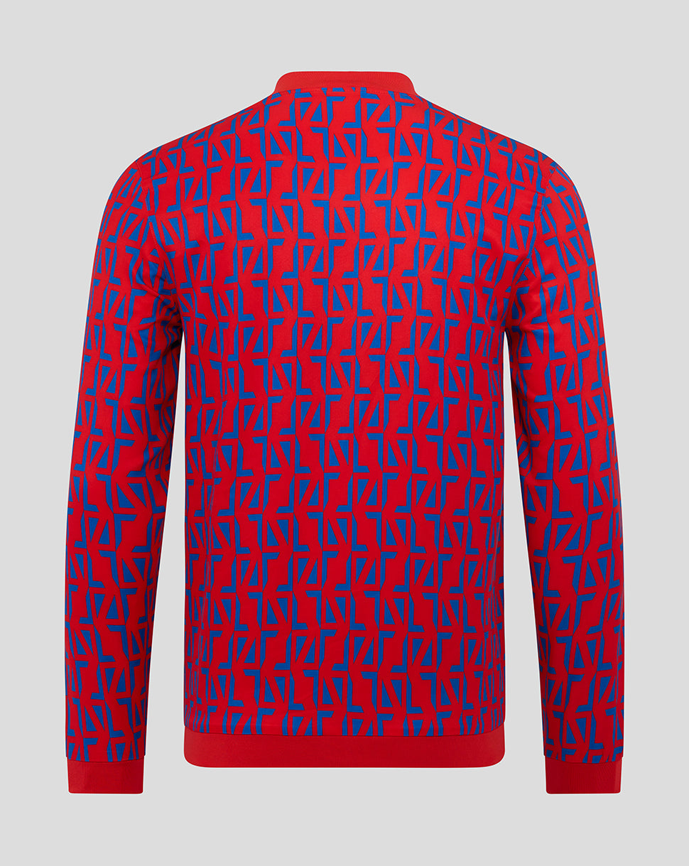 Rear view of Rangers Away Matchday Jacket with red base and blue geometric pattern across the back