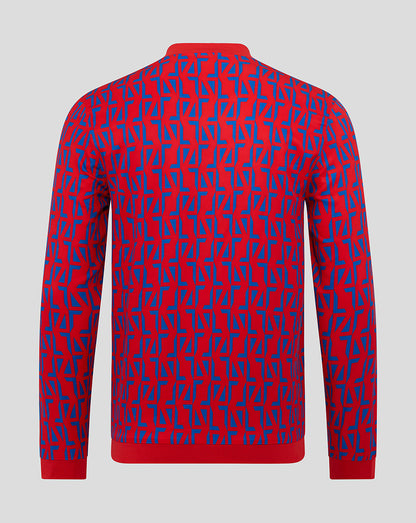 Rear view of Rangers Away Matchday Jacket with red base and blue geometric pattern across the back