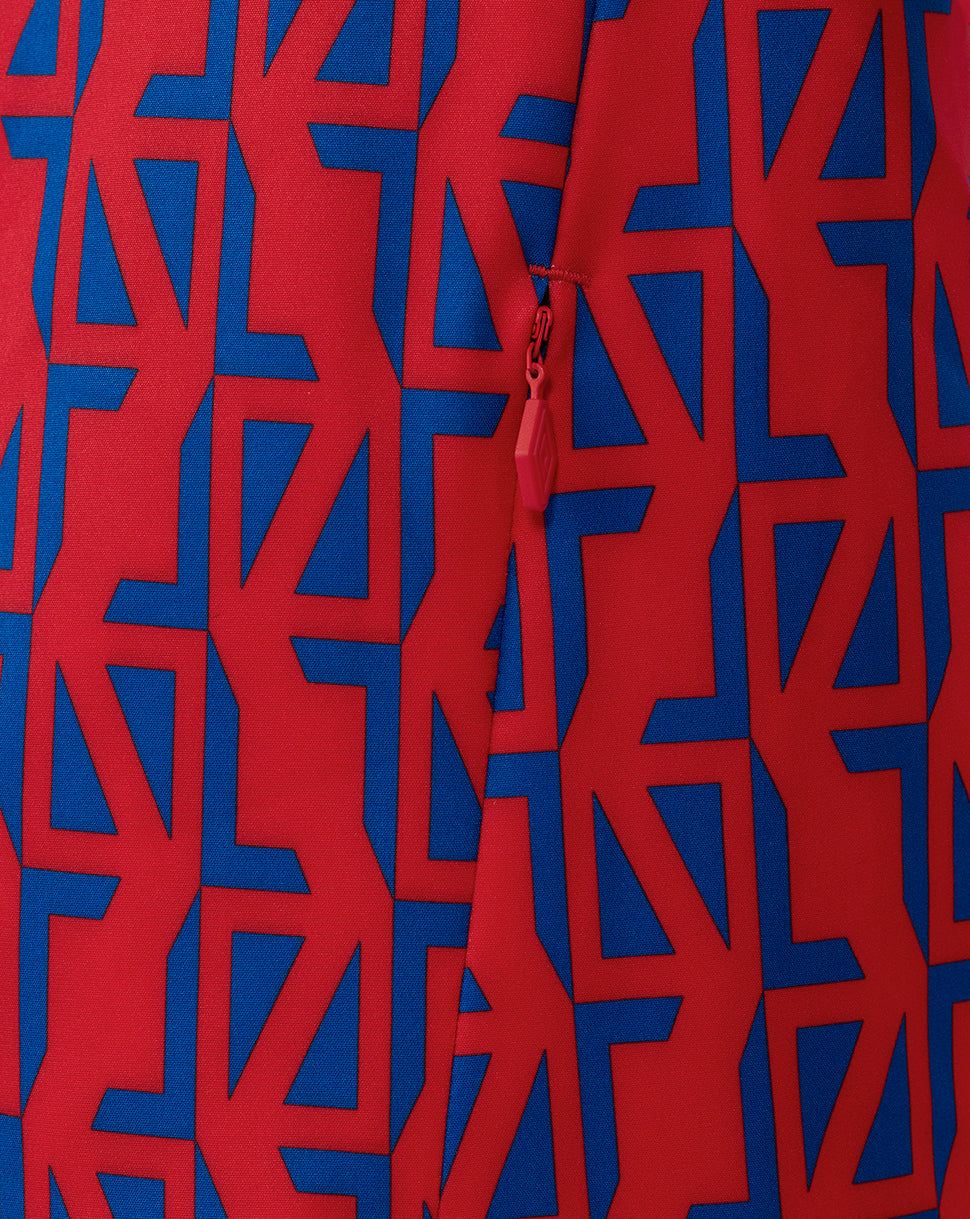 Close up of red zipper pull on the red and blue geometric printed Rangers jacket