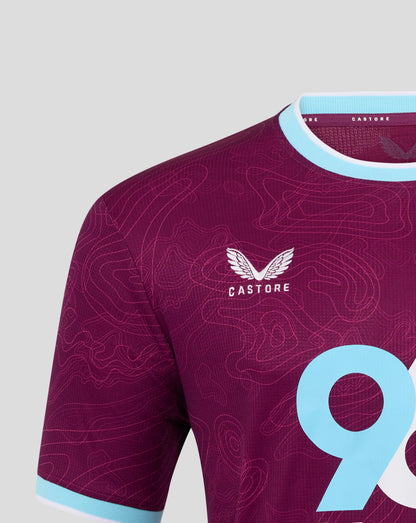 Front view showing crest and subtle pattern on burgundy Burnley FC women's home shirt with light blue trim.
