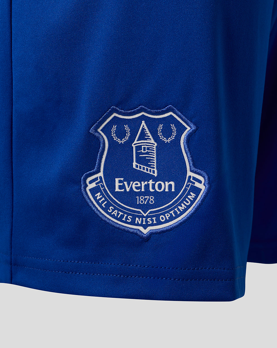 Close up of the Everton crest embroidered on the blue shorts.