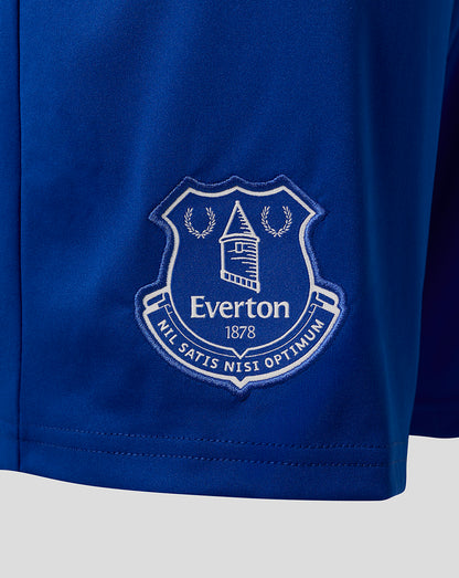 Close up of the Everton crest embroidered on the blue shorts.