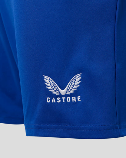 Close-up of blue Everton home shorts fabric showing white Castore crest embroidery