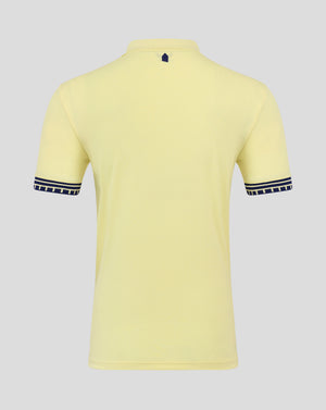 Junior Everton 25/26 away short sleeve shirt in pale yellow viewed from the back with a small navy shield at the neckline and Castore branding inside the collar.