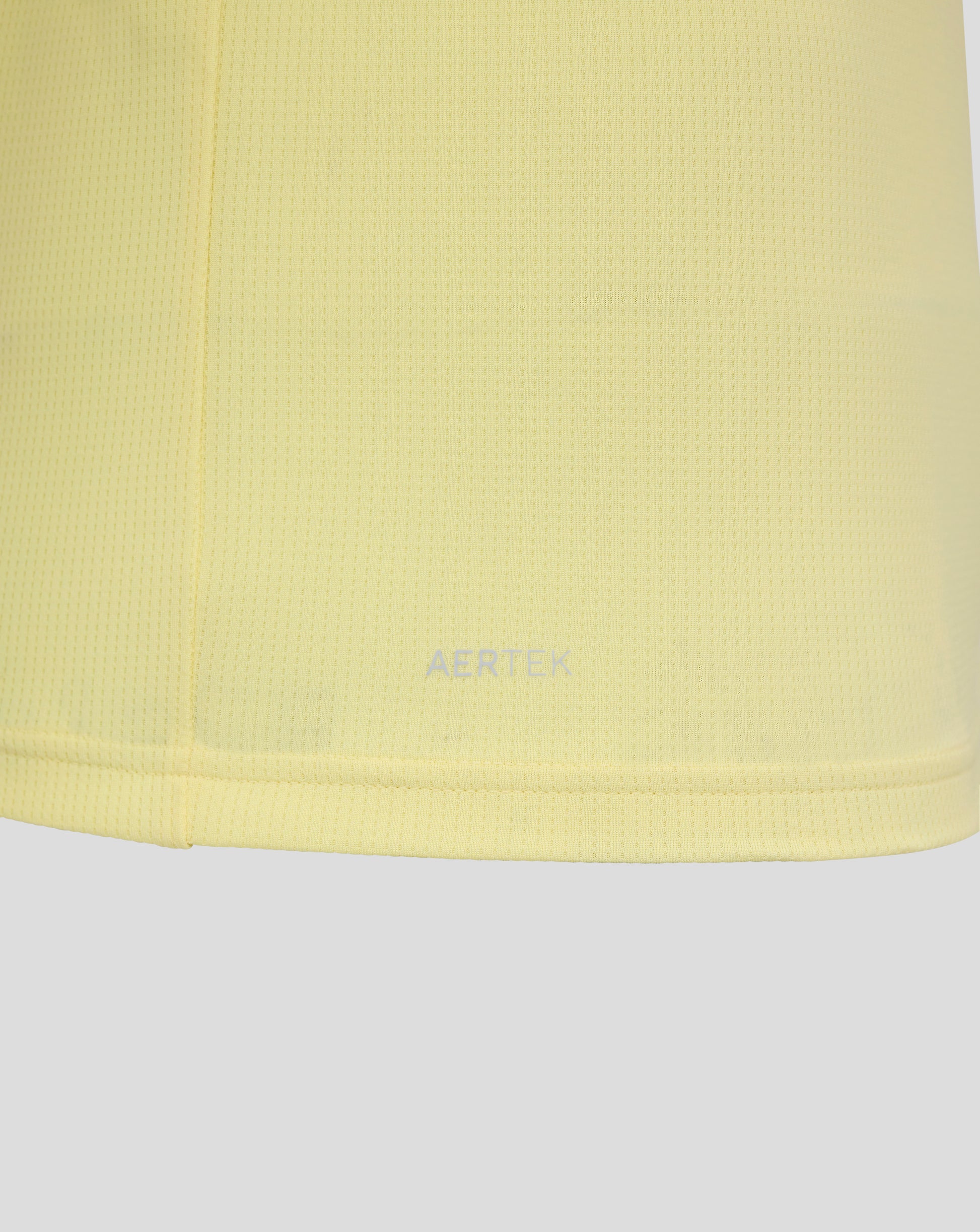 Close up of pale yellow mesh fabric from Everton FC 25/26 junior away short sleeve shirt.