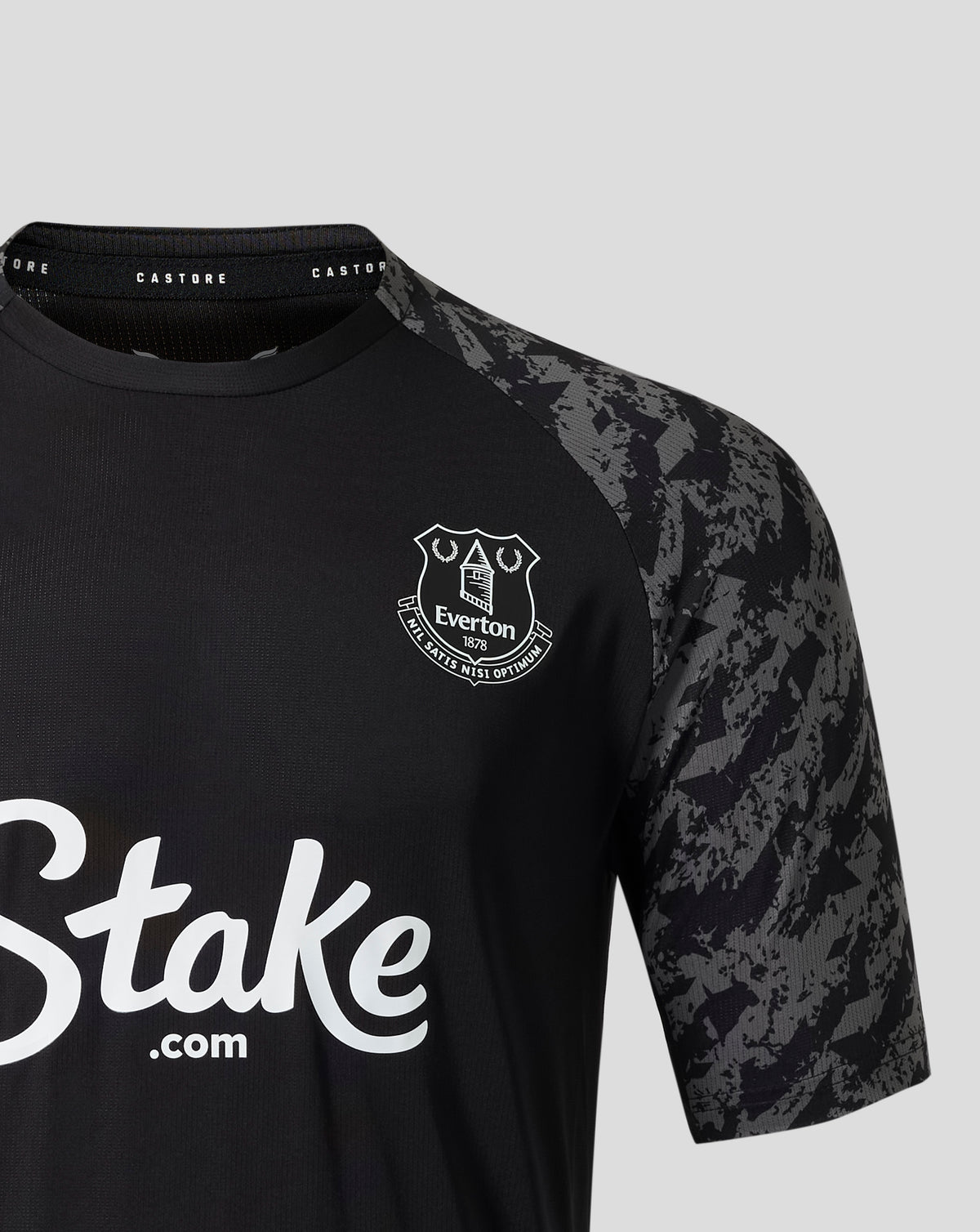 Close up of the collar on the Everton FC performance T shirt showing Castore branding and a camo sleeve panel