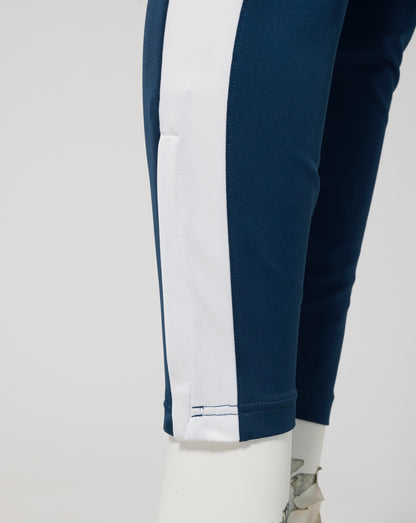 Detail of Everton FC 25/26 performance knit pants Moonlit Ocean with a white side stripe on navy fabric
