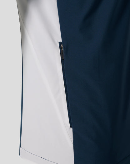 Close-up of Everton Moonlit Ocean packable hooded shower jacket showing navy fabric with a light side panel and a visible zipper.
