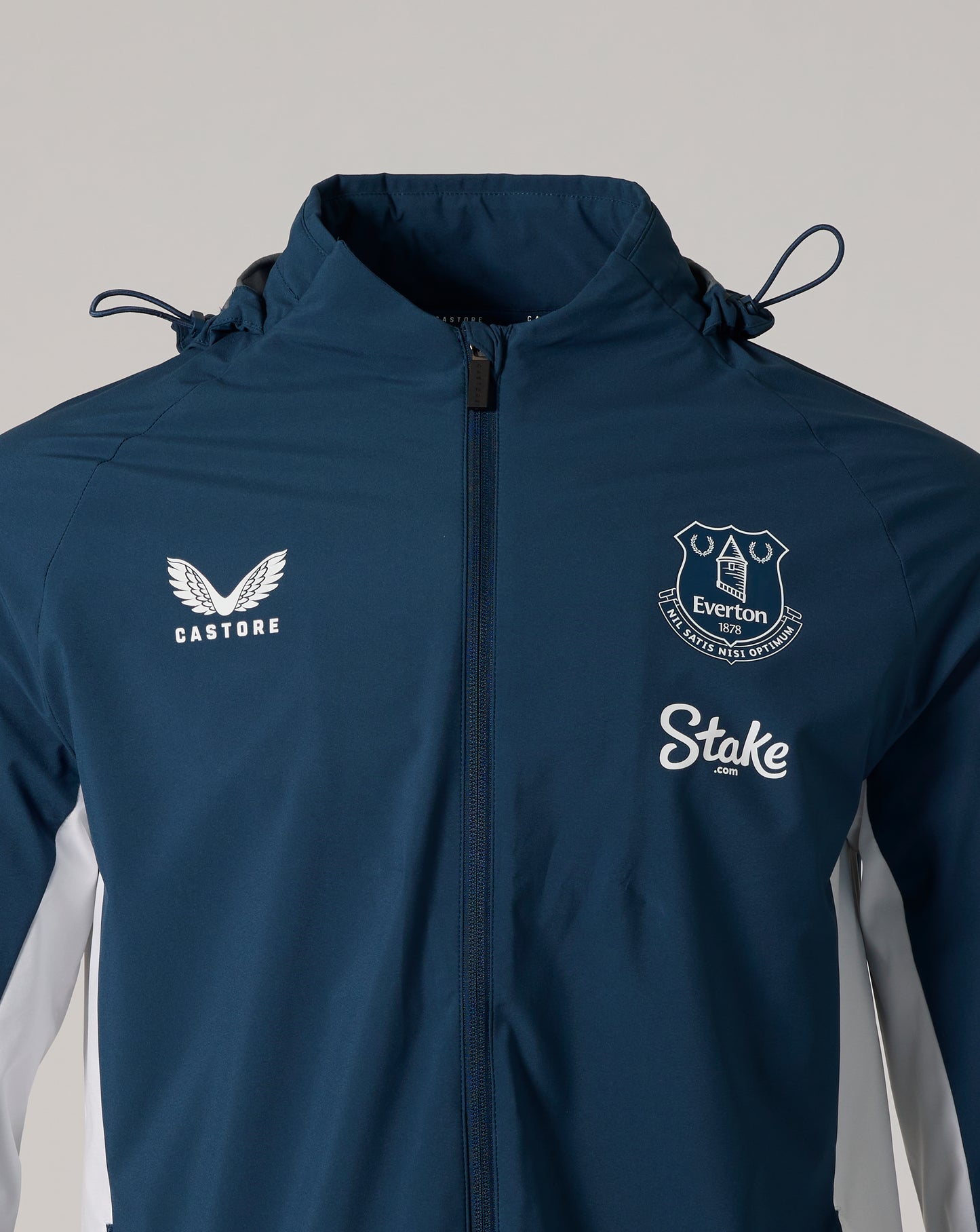 Moonlit Ocean Everton packable hooded jacket close up of chest with Everton crest and Castore logo and front zipper
