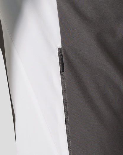 Close-up of white and charcoal fabric panels with a silver zipper on the Everton FC Thunderstorm packable hooded shower jacket
