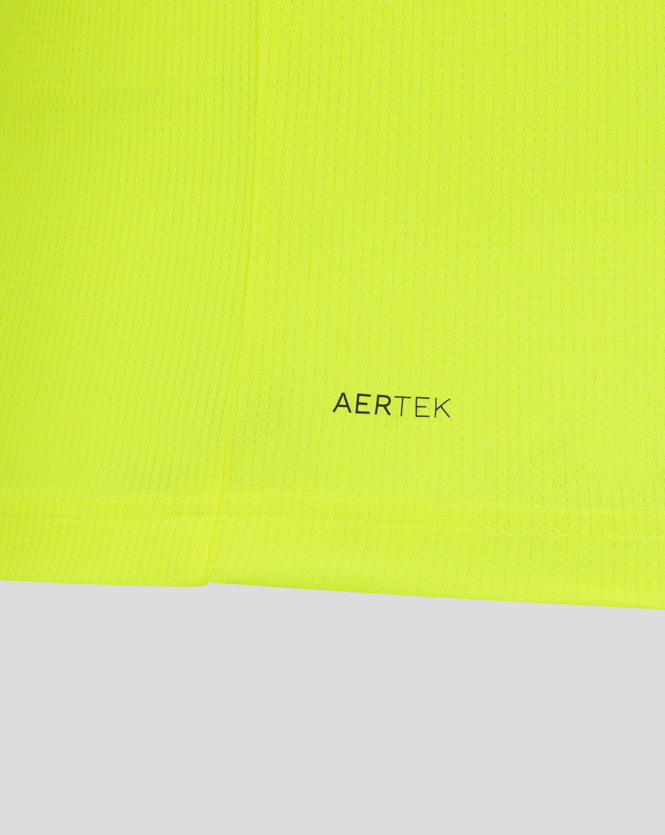 Close-up of neon yellow fabric with AerTek branding on the Preston North End replica shirt.