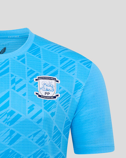 Close-up of blue Preston North End goalkeeper shirt showing crest and geometric print