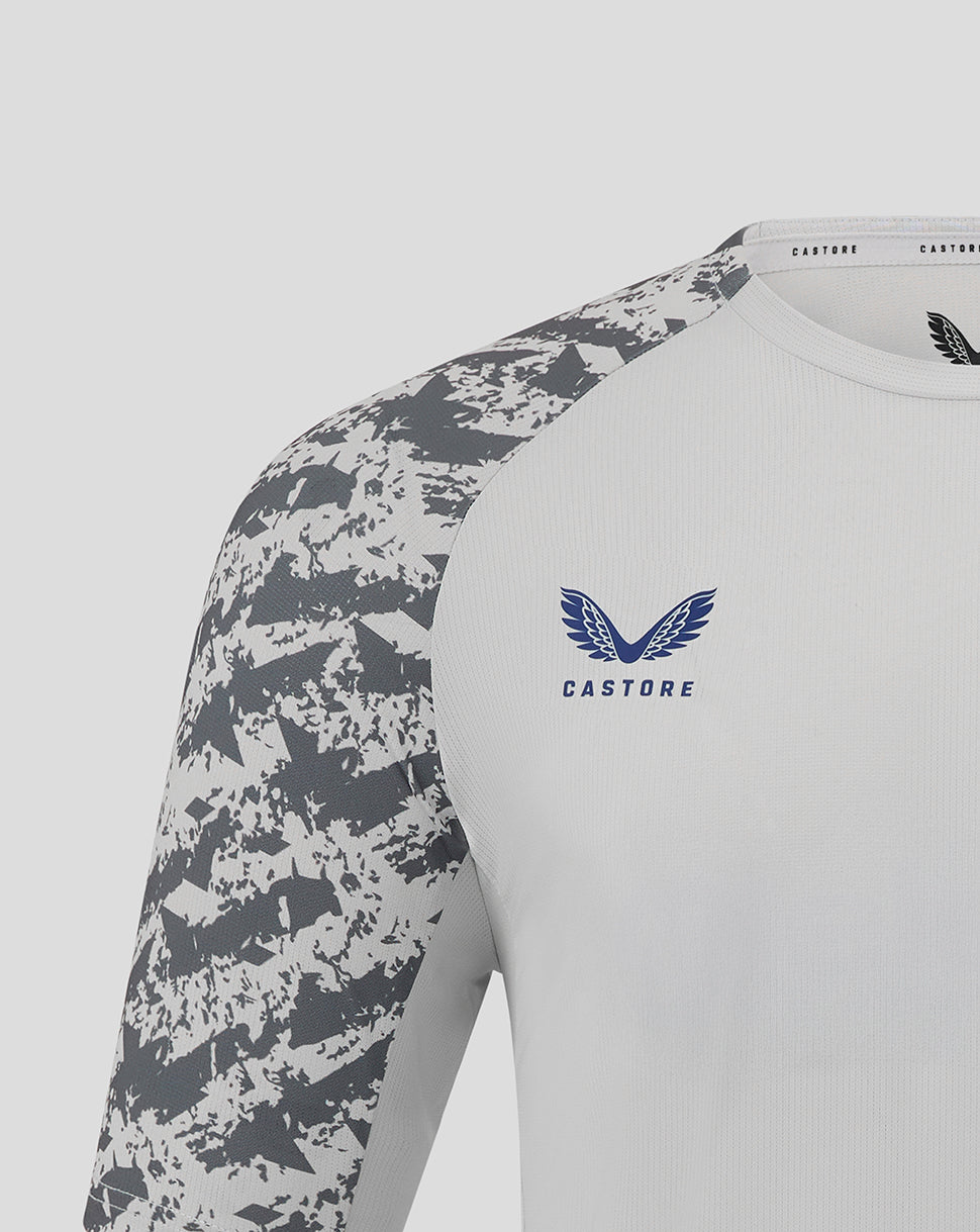 Preston training T shirt with white body and grey camo sleeves, featuring a blue Castore crest on the chest.