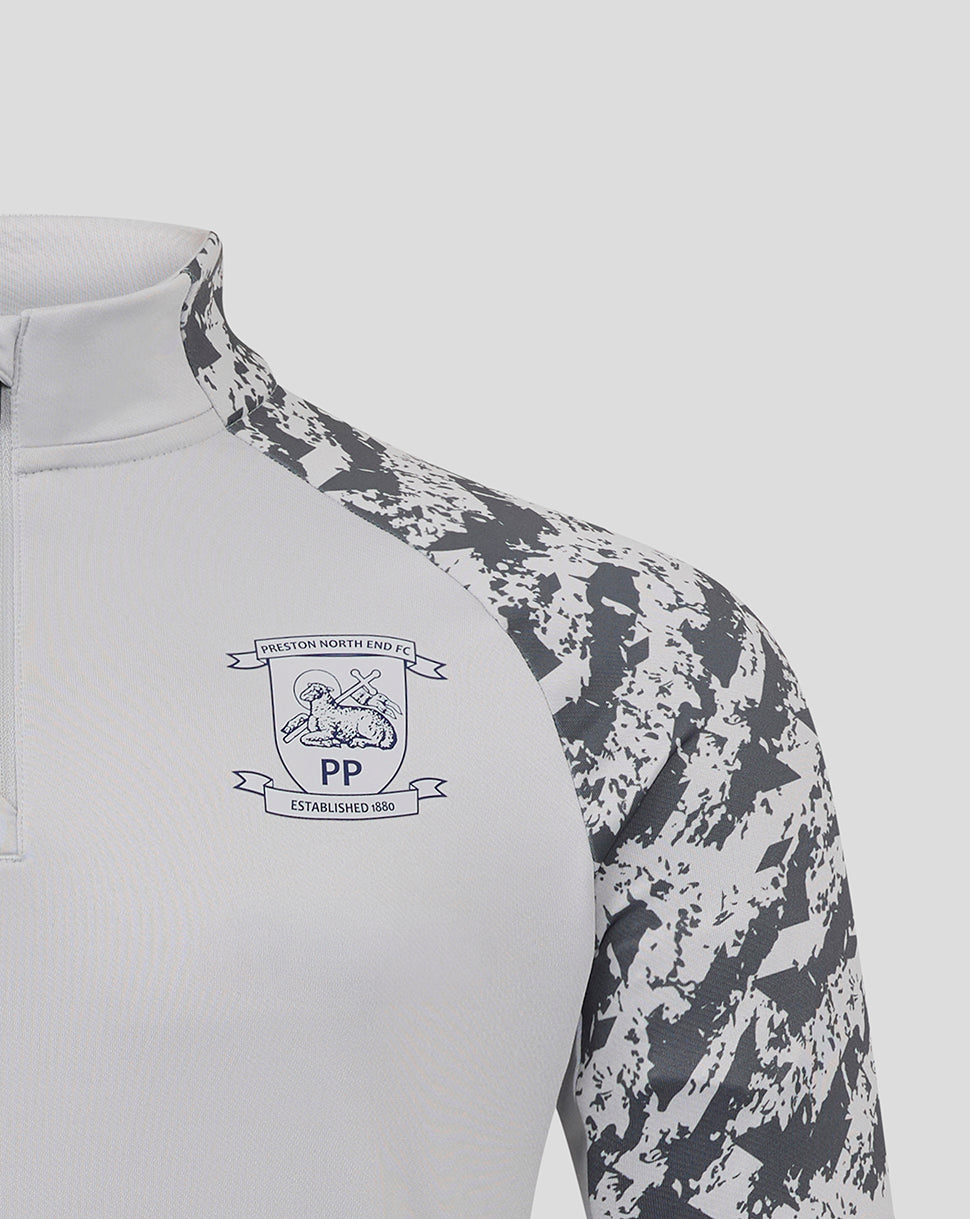 Partial front view of Preston North End training midlayer top with crest on white chest and gray camo sleeves