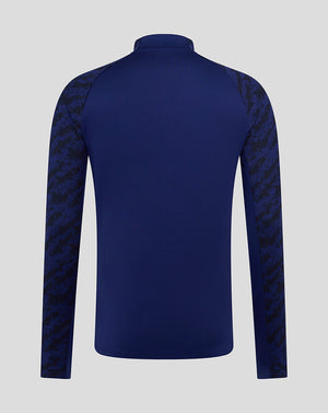 Back view of Preston Junior blue training midlayer showing solid back panel and camo sleeves.