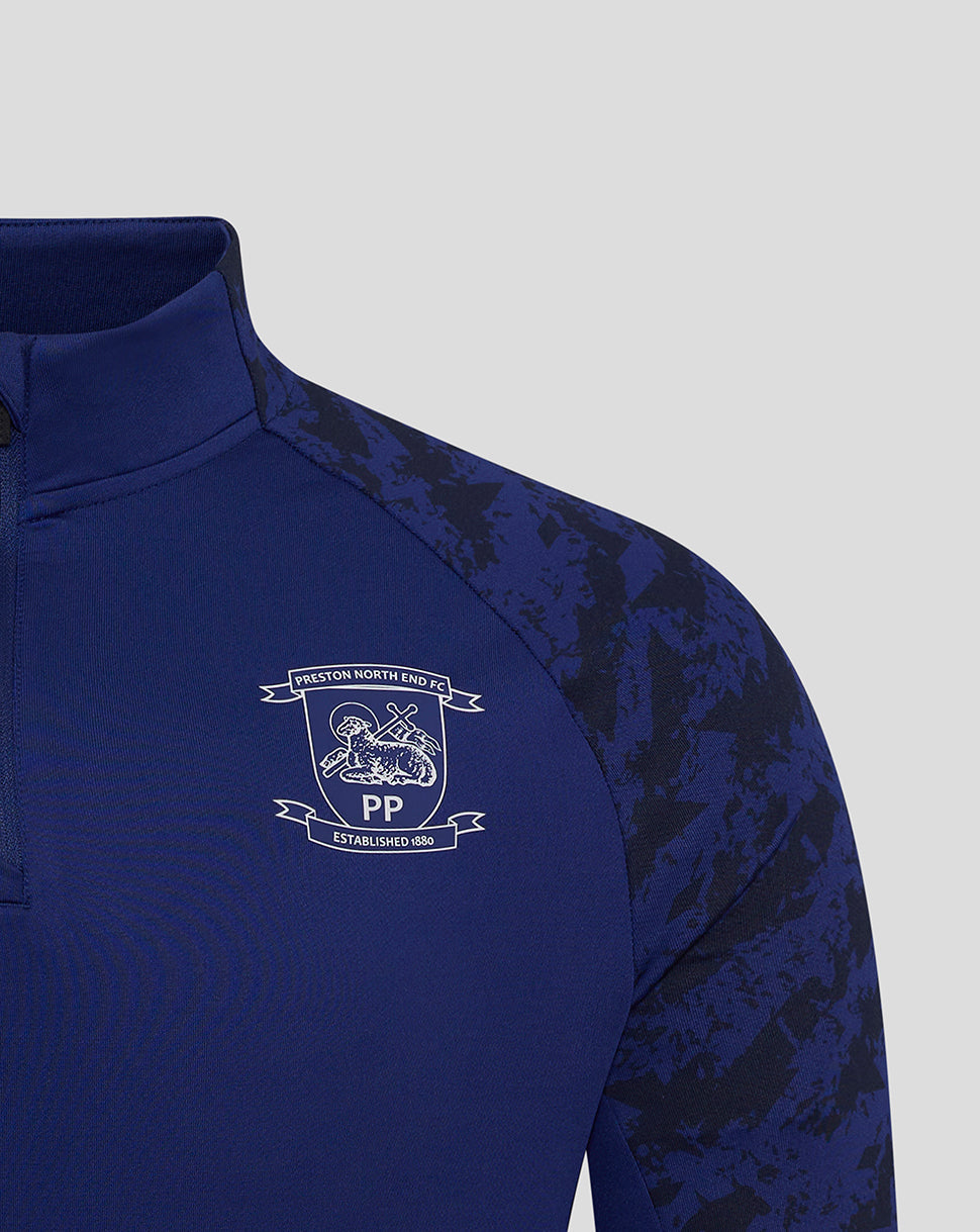 Blue Preston 25/26 training midlayer top chest area with club crest and Castore logo
