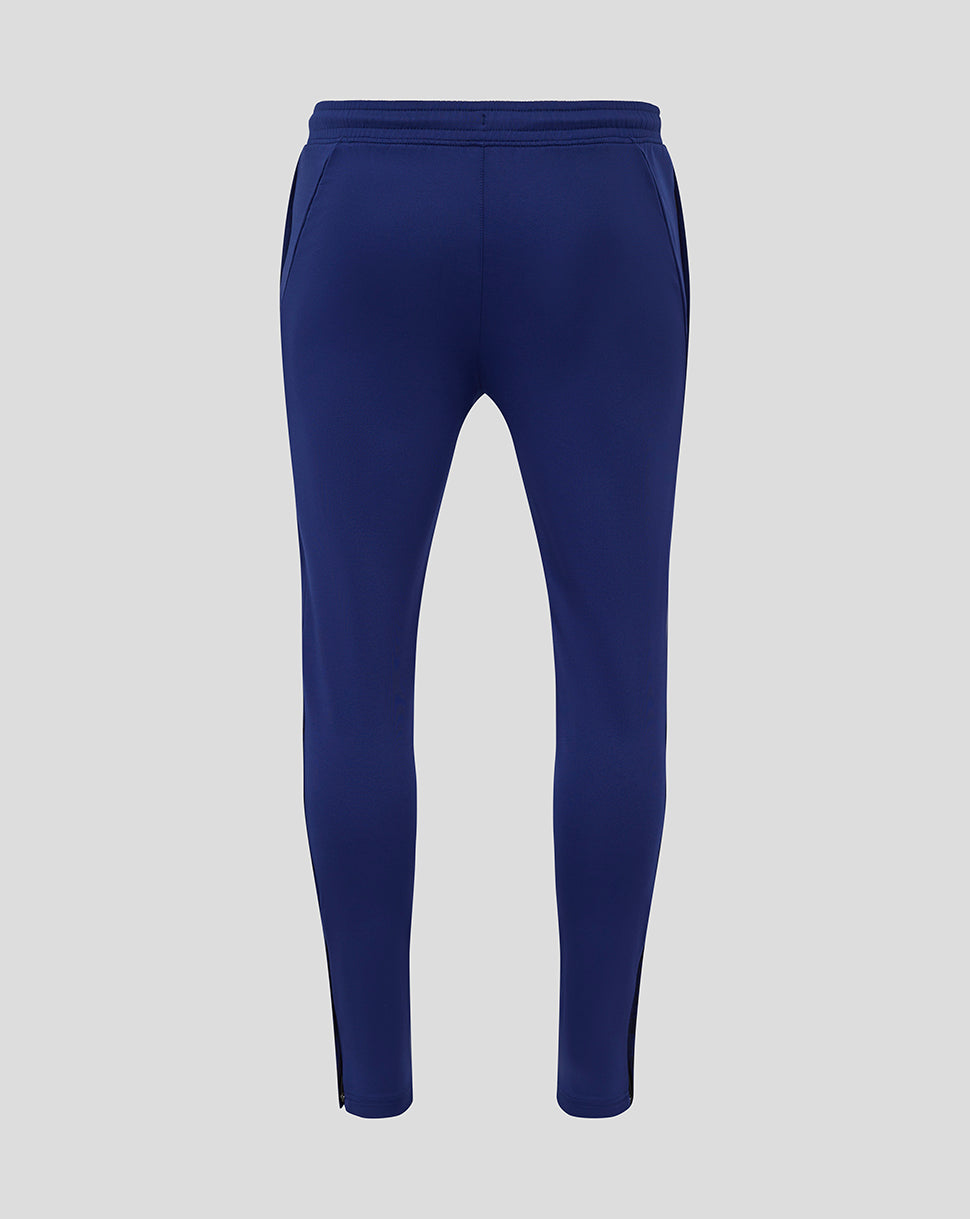 Back view of blue Preston training knit pants with elastic waistband