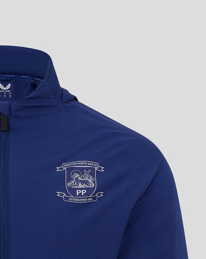 Front view of blue Preston North End training jacket showing club crest