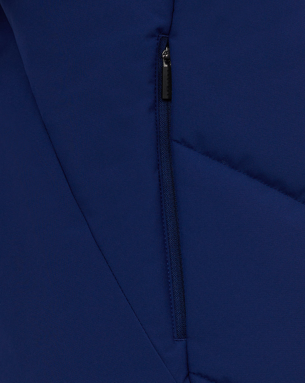 Close-up of a vertical zip pocket on the blue Castore training gilet