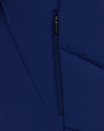 Close-up of a vertical zip pocket on the blue Castore training gilet
