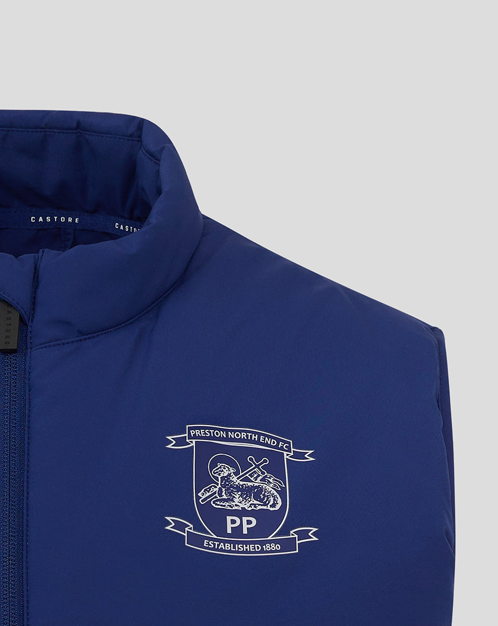 Close up of crest on chest of blue Preston North End training gilet.