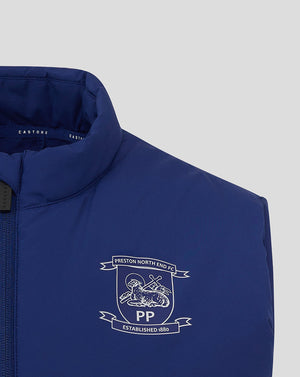 Close up of crest on chest of blue Preston North End training gilet.