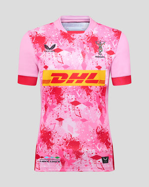 Pink Harlequins away pro shirt with bold yellow DHL sponsor across the chest and club crest on the front.