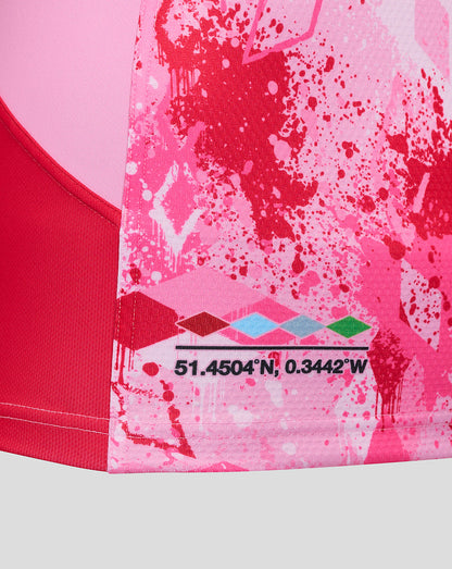 Lower portion of the pink Harlequins away pro shirt with coordinates and a colorful diamond motif at the hem.