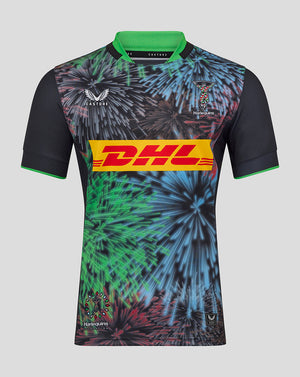 Harlequins Pro Shirt with a vibrant fireworks print, green collar, and DHL sponsor band across the chest.