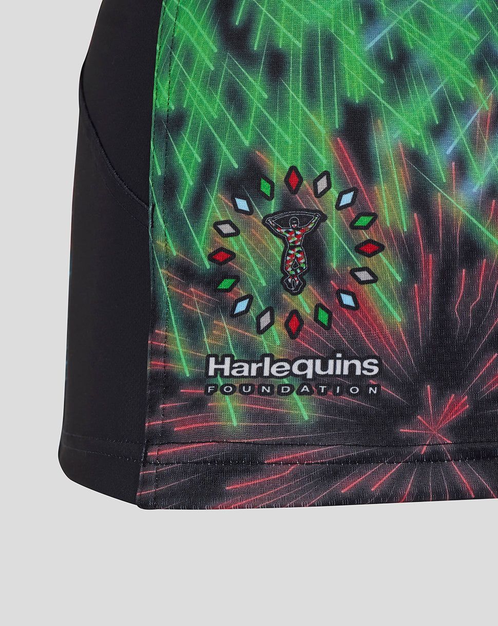 Side view of Harlequins Pro Shirt with foundation logo patch near hem and fireworks graphic on black fabric with green trim
