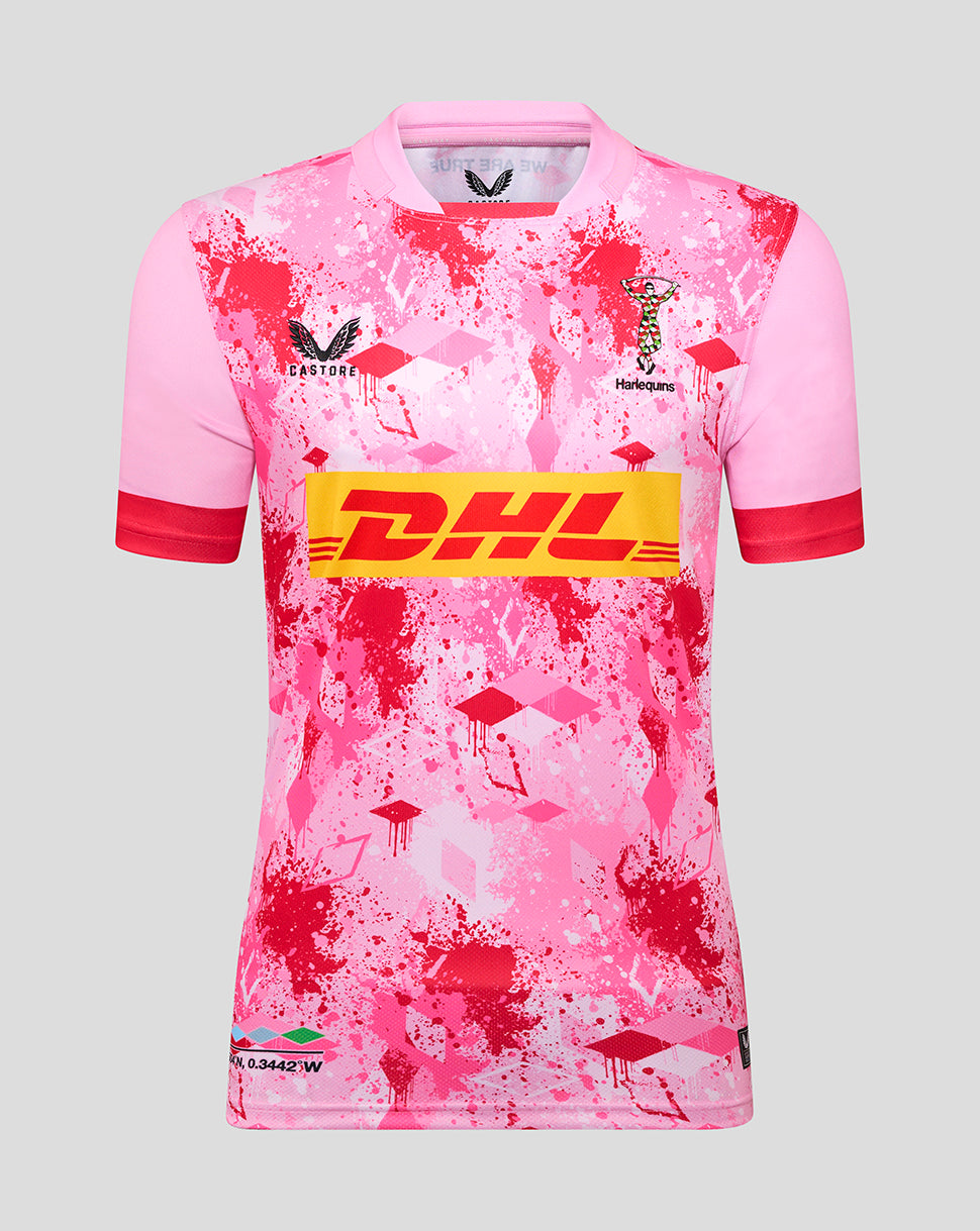 Front view of pink Harlequins away replica shirt with red splatter pattern and DHL sponsor across the chest; Harlequins crest and Castore logo visible.