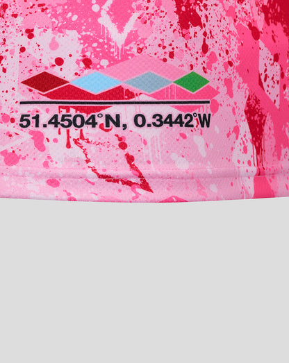 Lower section of the pink Harlequins shirt with coordinates graphic and colorful diamond pattern