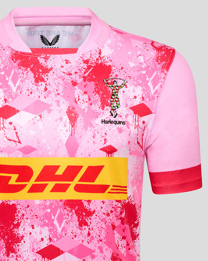 Close-up of chest on pink Harlequins away shirt detailing the Harlequins crest and DHL sponsor.