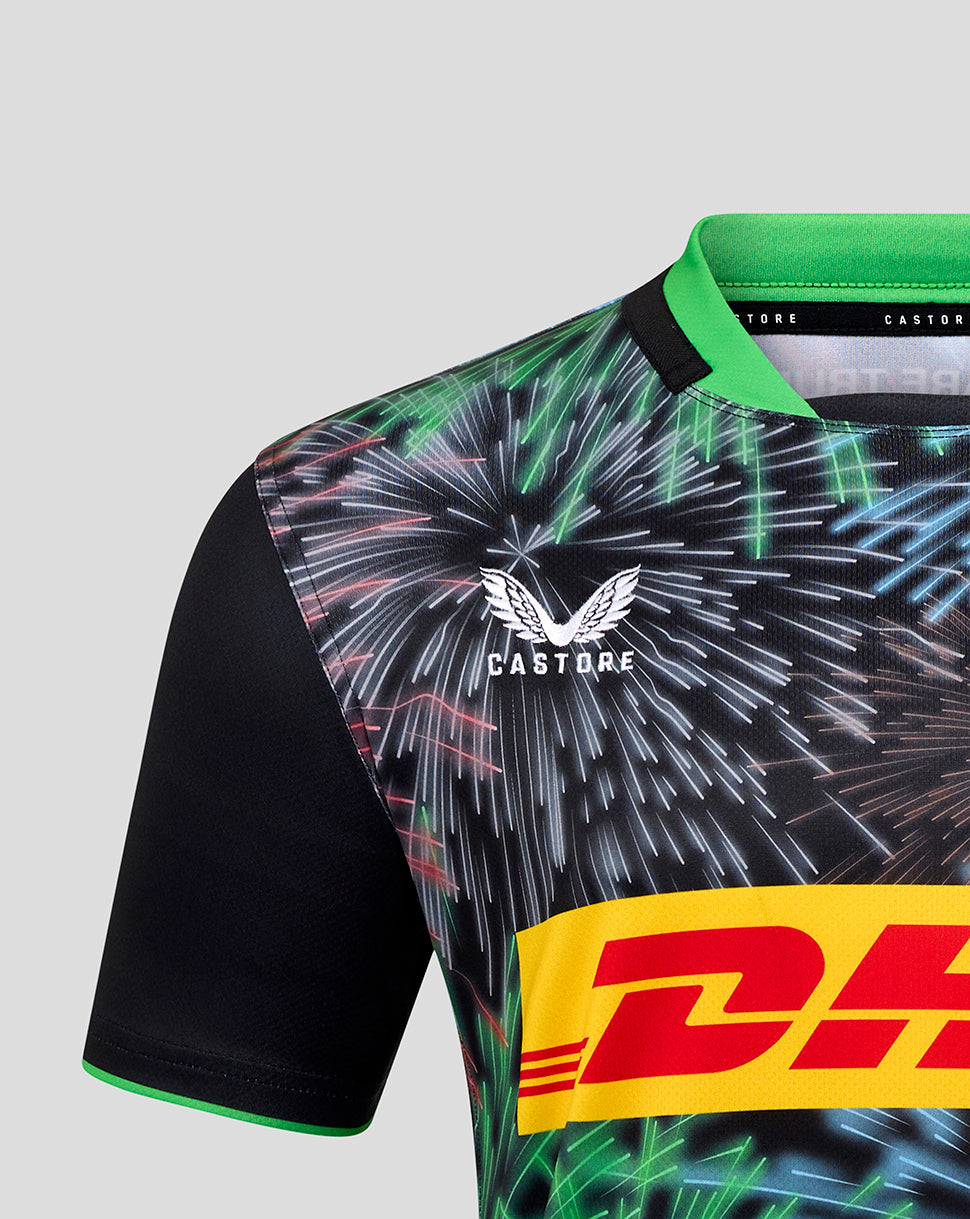 Close-up of upper chest on Harlequins Big Game Replica Shirt showing Castore branding and the Harlequins crest amid the fireworks pattern