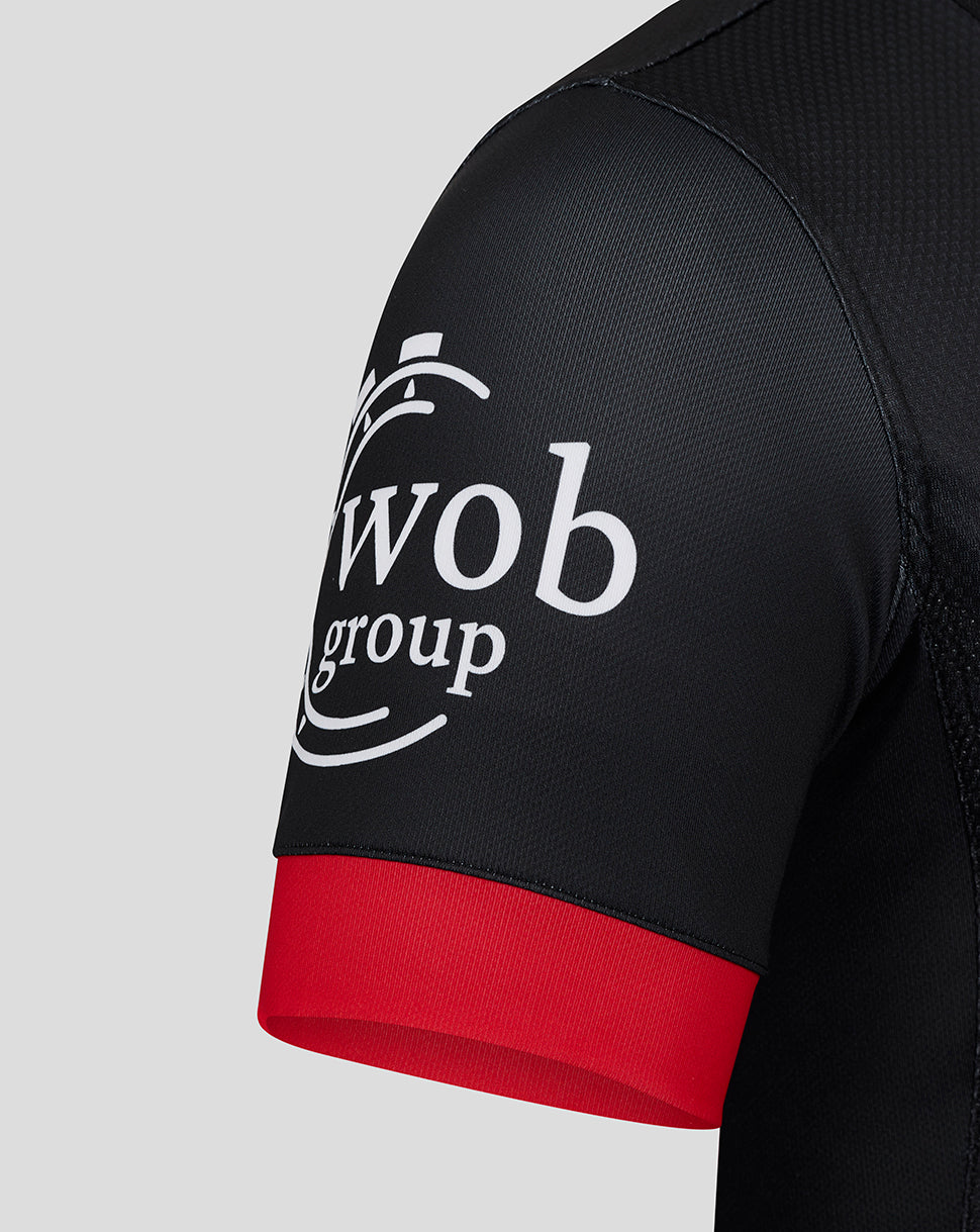 Black Saracens Pro Home Shirt sleeve with white sponsor logo and red cuff