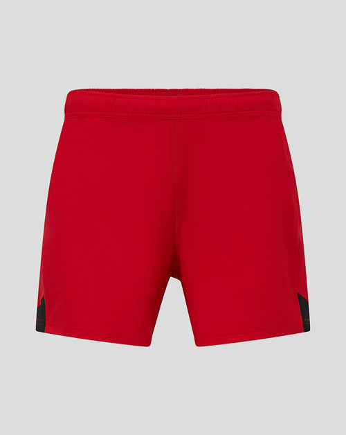 Back view of red Saracens Pro Home Shorts showing black side panels and elastic waistband