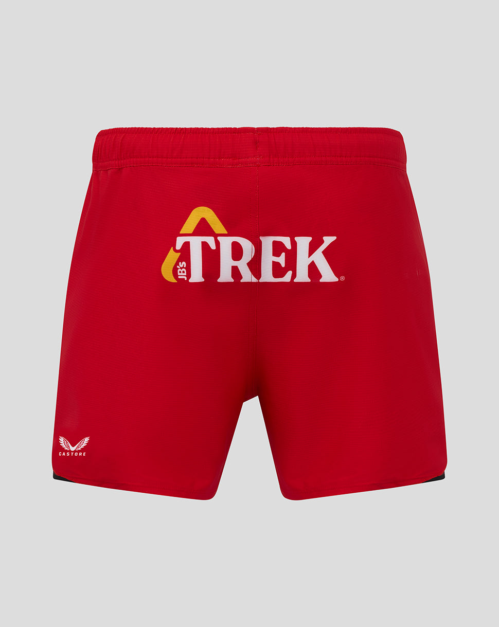 Back view of red Saracens Pro Home shorts with a large TREK logo and Castore emblem on the lower left.