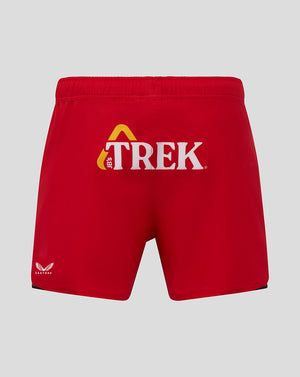 Back view of red Saracens Pro Home shorts with a large TREK logo and Castore emblem on the lower left.