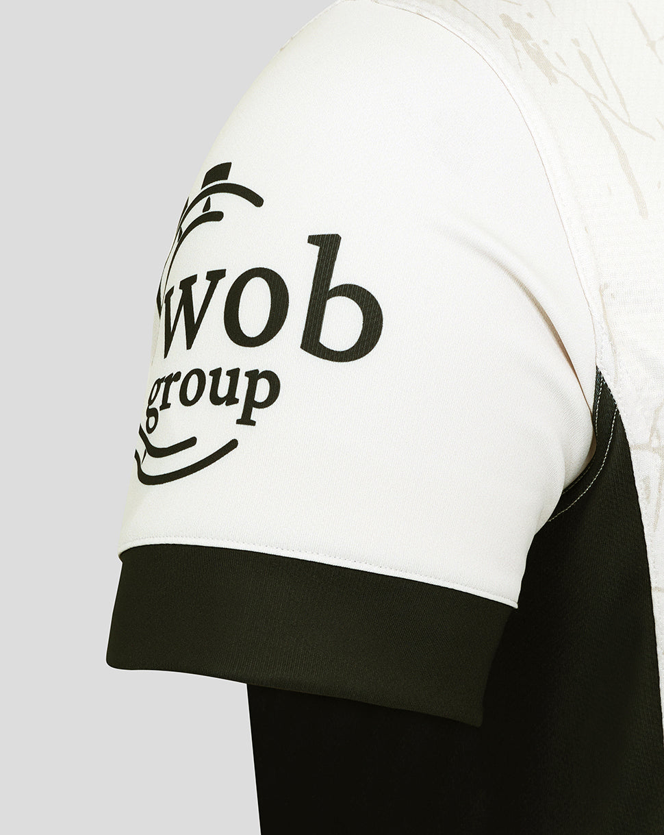 Two-tone sleeve detail from the Saracens Pro Away Shirt showing white upper and black cuff with sponsor logo.