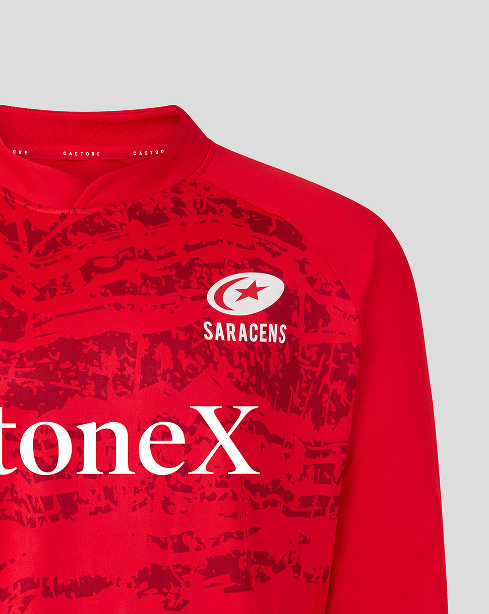 Close-up of red Saracens midlayer top showing crest on the chest and bold front graphic