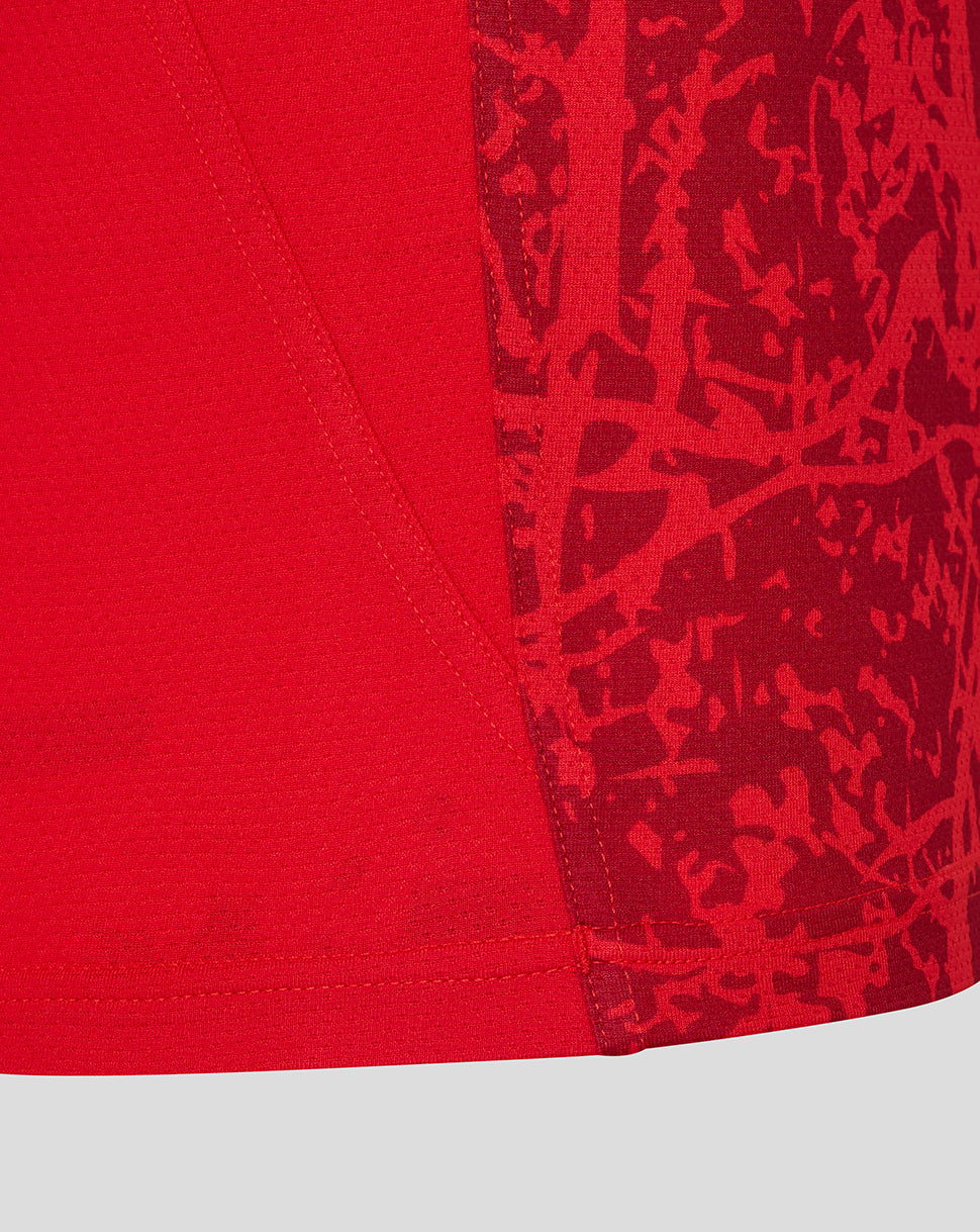 Close-up of red fabric with visible seam on a Saracens matchday short sleeve tee