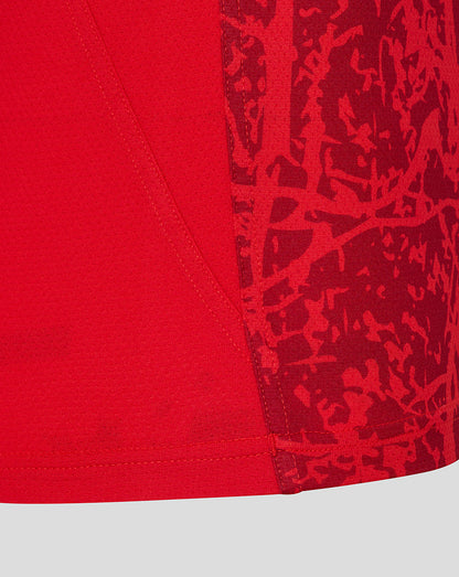 Close-up of red fabric with visible seam on a Saracens matchday short sleeve tee